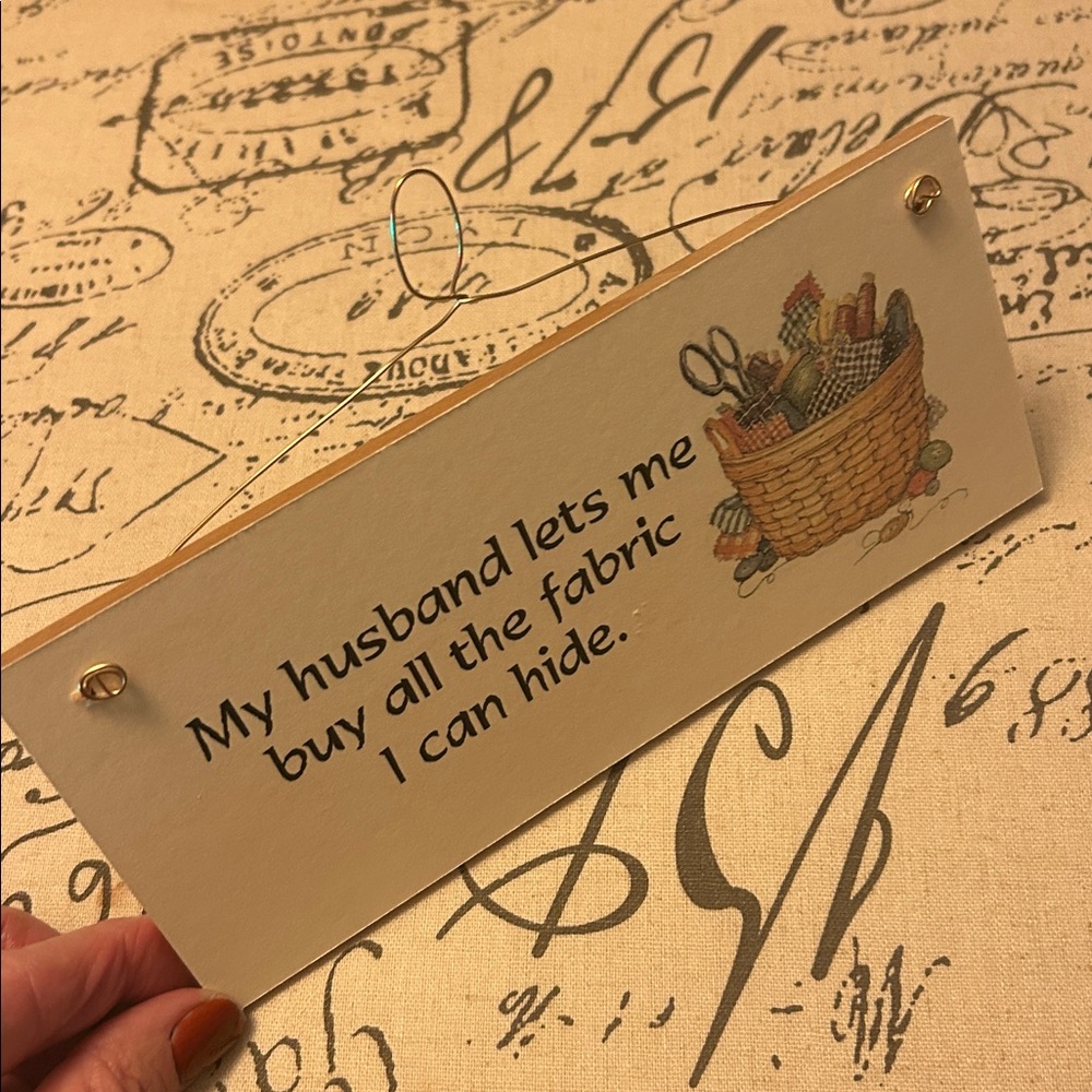 “My husband lets me buy all the fabric I can hide” wooden sign 🧺 🧵 🪡